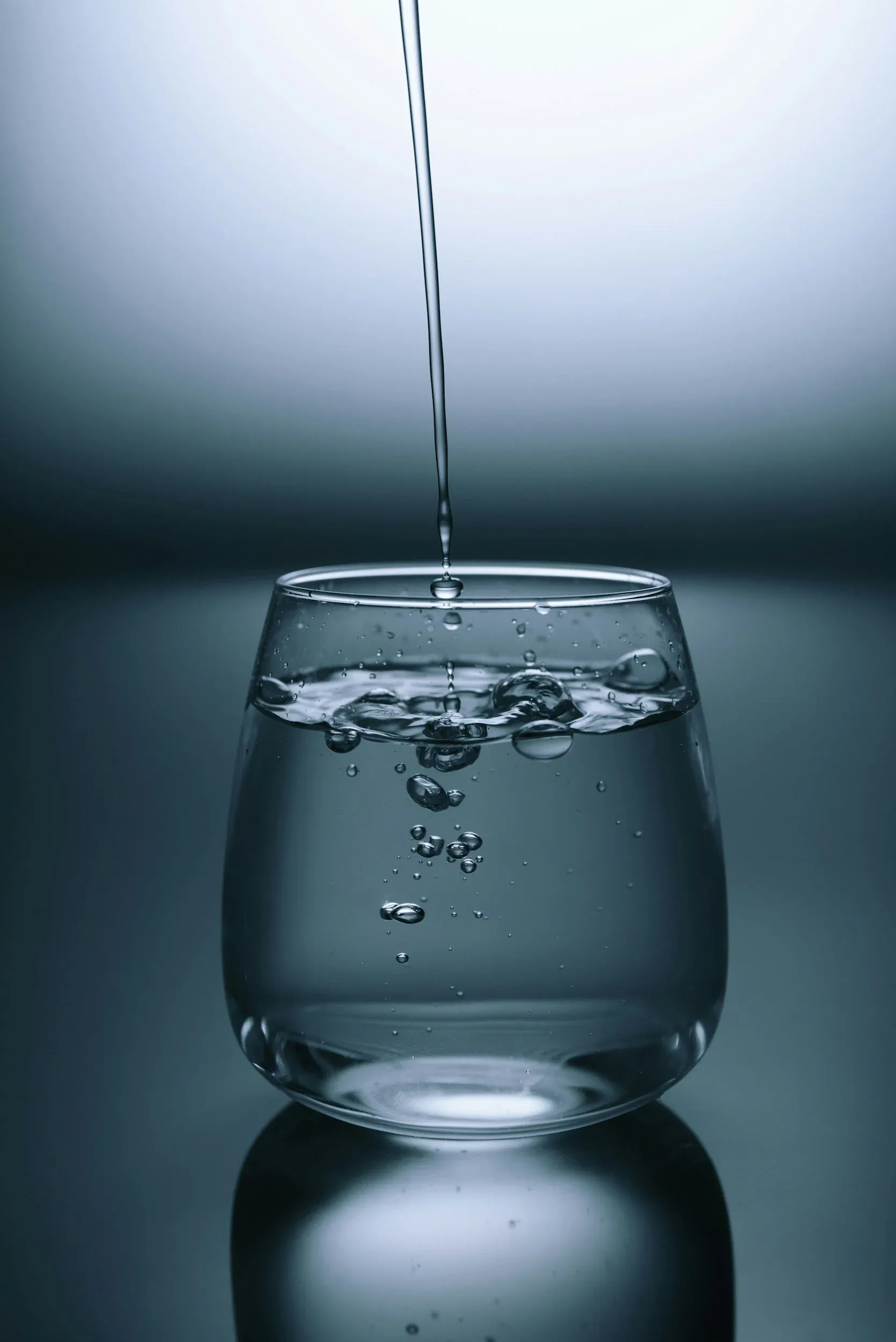 Water pouring into a glass on a Summerville kitchen counter